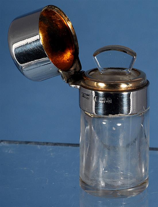 An Edwardian silver mounted glass scent bottle & a pair of scent bottles.